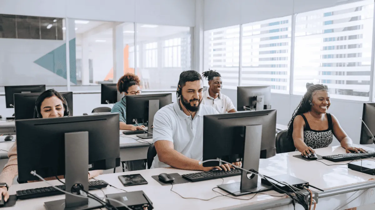 Customer service reps studying the data from a customer service chatbot