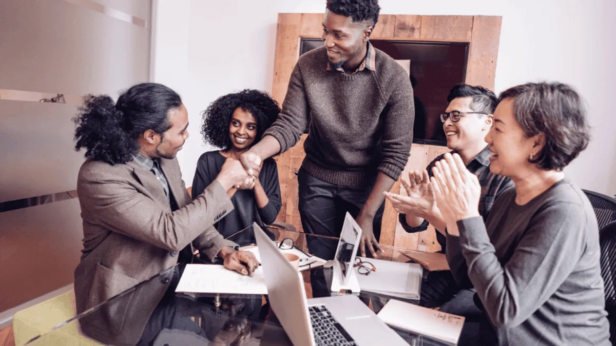 Content team talking about how to best maximize the use of AI tools