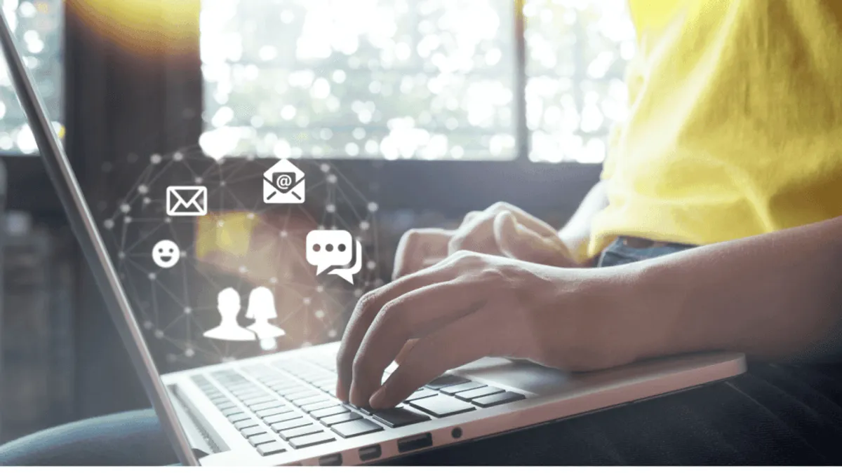 A person using a laptop for content creation with natural language processing