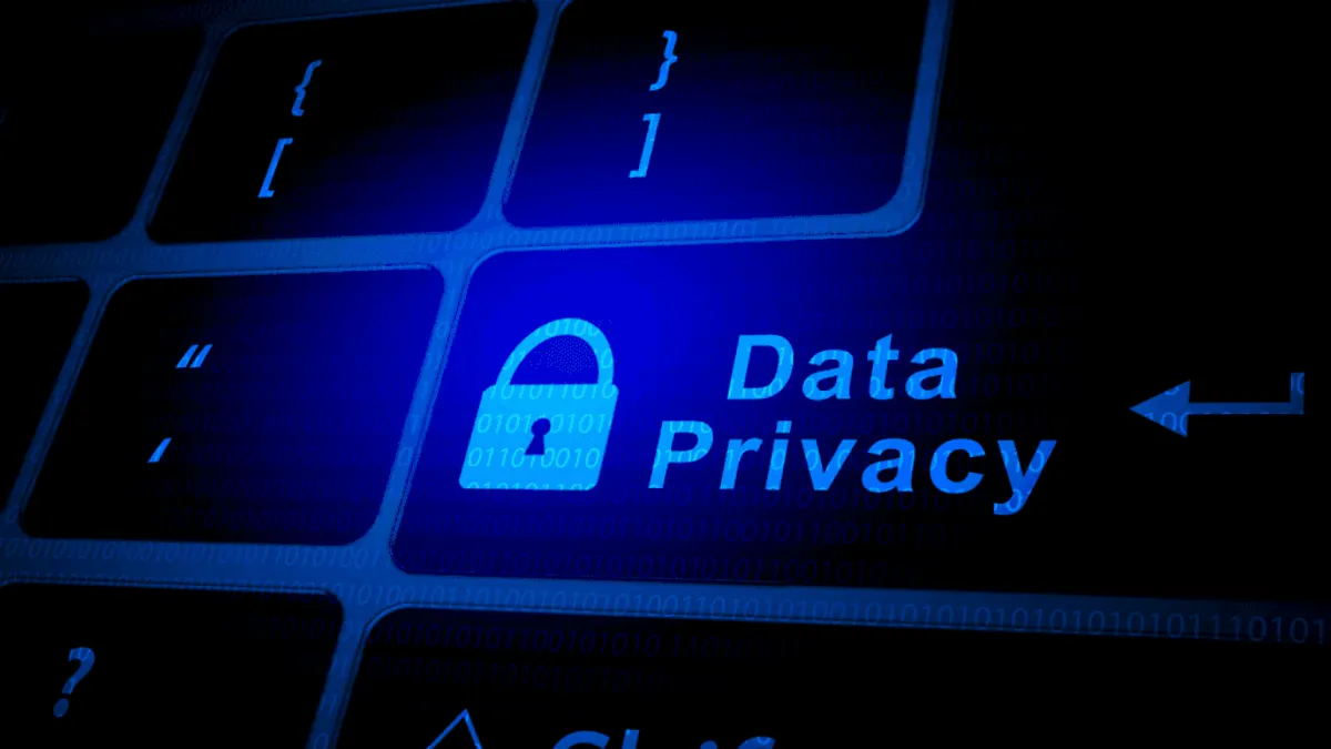 A HR manager discussing data privacy and security with a team of HR professionals