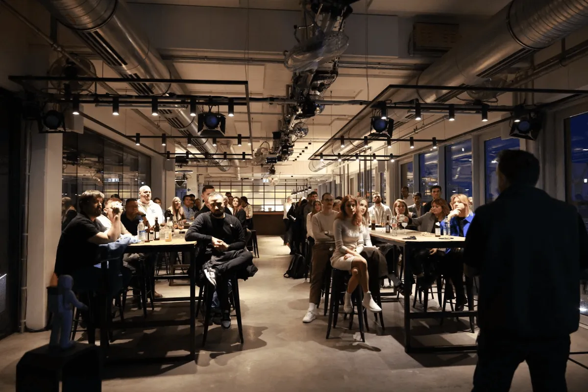 Tim Cakir presenting to an audience at the NPU office in Munich, Germany.