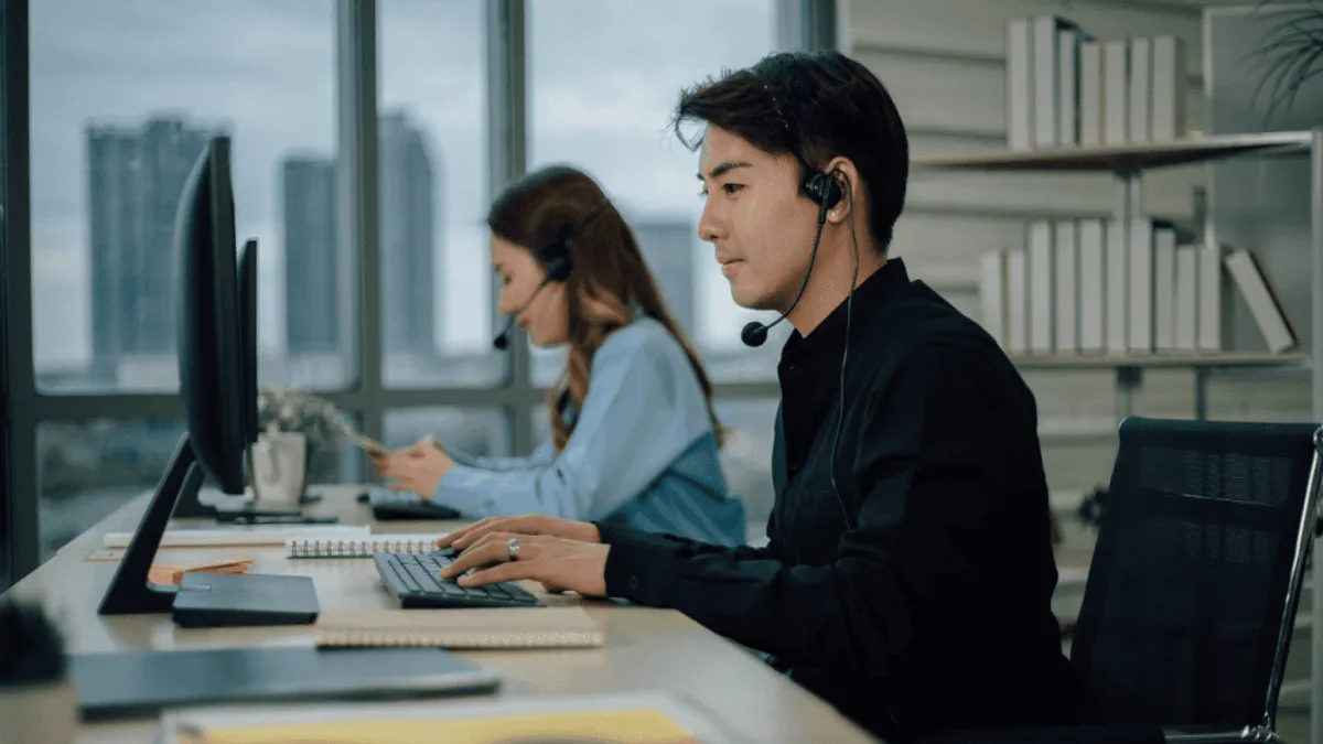 Photo of a customer support agent using a conversational ai platform for work