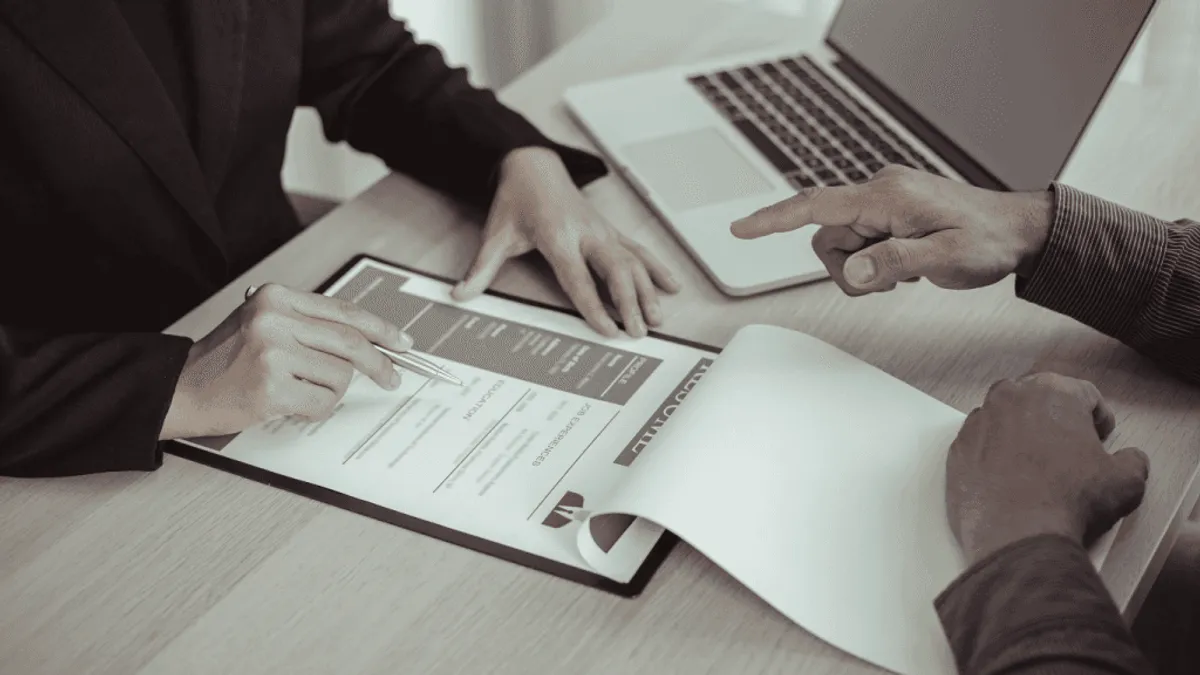 Hiring managers screening candidates and scheduling interviews