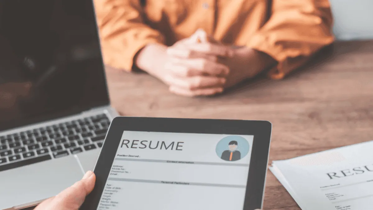 A HR manager screening resumes manually