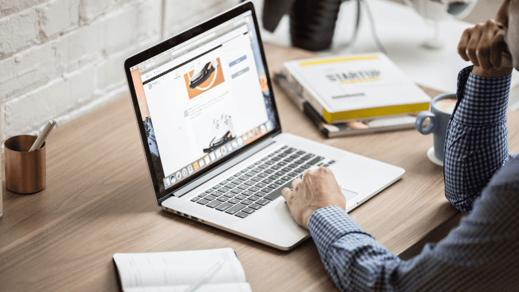 A person using a laptop to create personalized marketing messages using an AI tool and generative AI