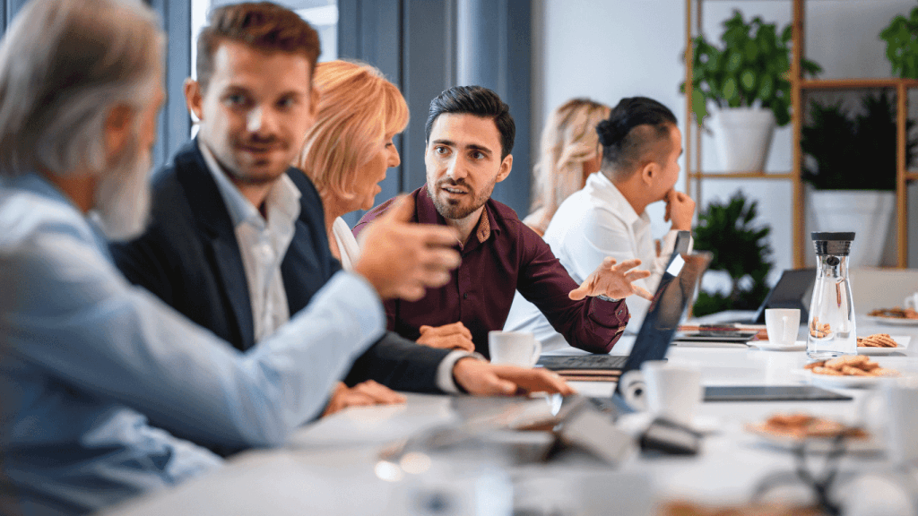 A group of sales team members discussing sales training ideas